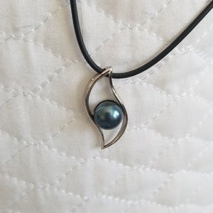 Blue pearl necklace on black vegan leather